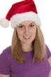 Junge freundliche Frau blickt weihnachtlich keck Junge freundliche Frau blickt weihnachtlich keck