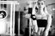 Photo: Young woman weight training Young woman weight training