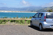 rear side view of car parked near to beach