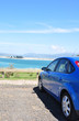 rear side view of car parked near to beach rear side view of car parked near to beach