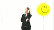 Woman standing between two balloons