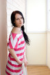 Caucasian young woman in light room Caucasian young woman in light room