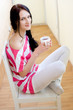 Caucasian young woman with cup of tea Caucasian young woman with cup of tea