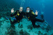 scuba divers having fun