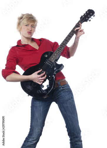 Photo: jolie jeune femme jouant de la guitare électrique jolie jeune femme jouant de la guitare électrique