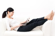 beautiful asian woman using laptop on the sofa