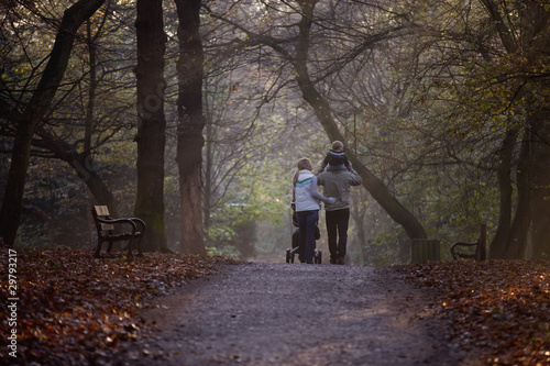Photo: A family walking in the park A family walking in the park