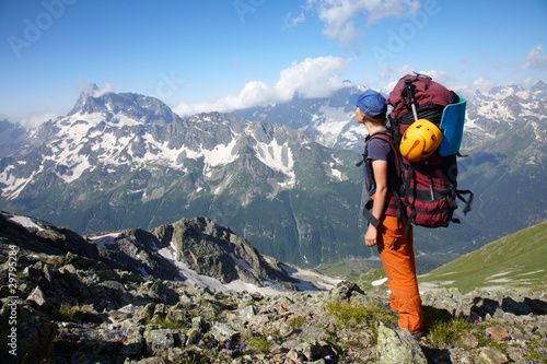 Photo: Girl with backpack looking into the distance Girl with backpack looking into the distance
