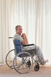Smiling man in his wheelchair at home Smiling man in his wheelchair at home