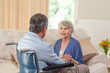 Senior couple talking in the living room at home Senior couple talking in the living room at home