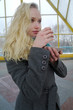 The young white girl drinks hot tea in the winter