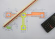 building plan with ruler and calculator