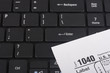 Laptop with a form 1040 Laptop with a form 1040