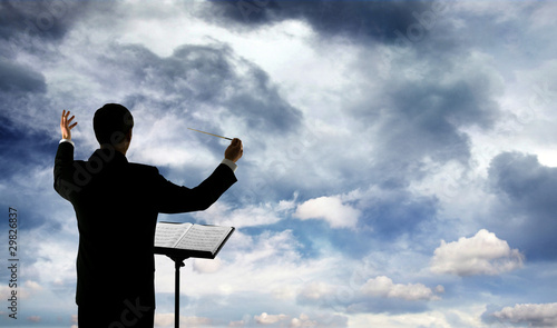 Photo: Music conductor and clouds Music conductor and clouds