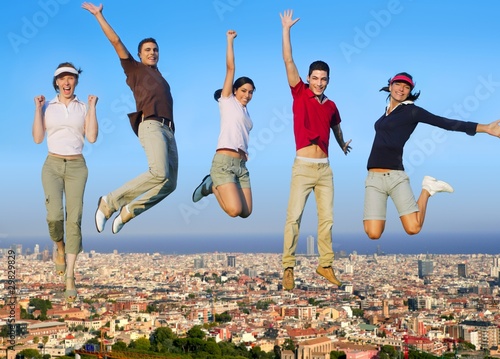 Photo: Jumping young people group on city buildings Jumping young people group on city buildings