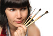 Beautiful girl holding brushes. Beautiful girl holding brushes.
