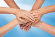 Hands on top of each other blue Hands on top of each other blue