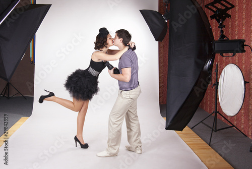 Photo: Young model kissing the photographer Young model kissing the photographer