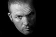 Low key portrait of menacing looking caucasian man
