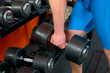 Photo: Man arm lifting a dumbell Man arm lifting a dumbell
