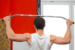 Back of a man lifting weights