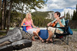 Female listening to man playing guitar Female listening to man playing guitar