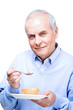 Man eating grapefruit