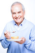 Old man eating fruits