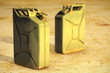 Petrol cans on dirty ground