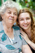Photo: Family portrait of young woman and her grandmother Family portrait of young woman and her grandmother