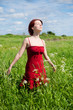 Bright picture of lovely woman walking in the field