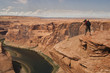 Man take pictures of Horseshoe Bend in Arizona