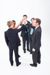 Five confident businesspeople high fiving