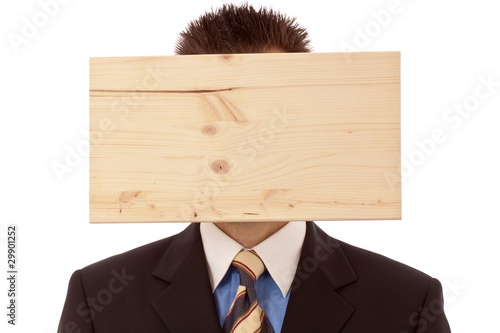 Photo: Mann-Geschäftsmann mit Denkblockade-Brett vorm Kopf Mann-Geschäftsmann mit Denkblockade-Brett vorm Kopf