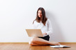 business woman at home with laptop