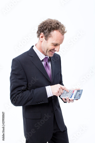 Foto: Businessman using pocket calculator Businessman using pocket calculator