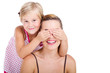 playful daughter covering mothers eyes
