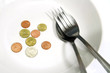 Asia coins in white plate with spoon Asia coins in white plate with spoon