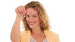 Curly haired woman showing us the keys of her new home