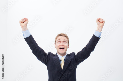 Photo: Enthusiastic businessman raising his arms Enthusiastic businessman raising his arms