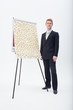 Businessman standing at flipchart with abundance of post-its