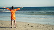 Video: Woman at the beach rising hands to the sky Woman at the beach rising hands to the sky