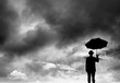 businessman holding umbrella