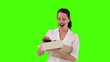 Dark-haired woman opening a present