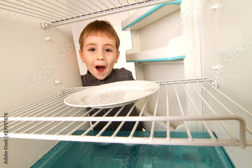 Photo: Boy and Empty Refrigerator Boy and Empty Refrigerator