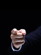 Index finger on black background