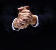 Praying hands on black backgroun