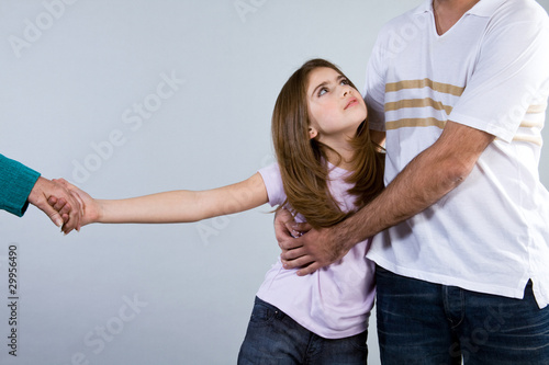 Photo: Girl holding her father Girl holding her father
