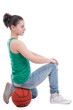 Beautiful young basketball woman in studio