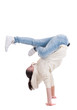 Young teenage woman dancing on white